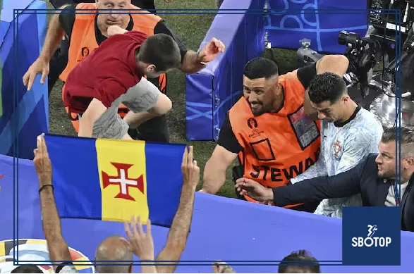 SBOTOP Cristiano Ronaldo's Close Call: Fan Jumps from Crowd After Portugal's Defeat to Georgia