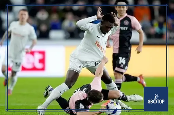 SBOTOP: Rumarn Burrell Strikes as Ten-Man Swansea Fall Short in QPR’s Hard-Fought 1-0 Victory